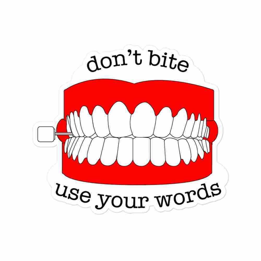 A sticker of a set of wind-up teeth with text reading "don't bite, use your words" in a black typewriter typeface.