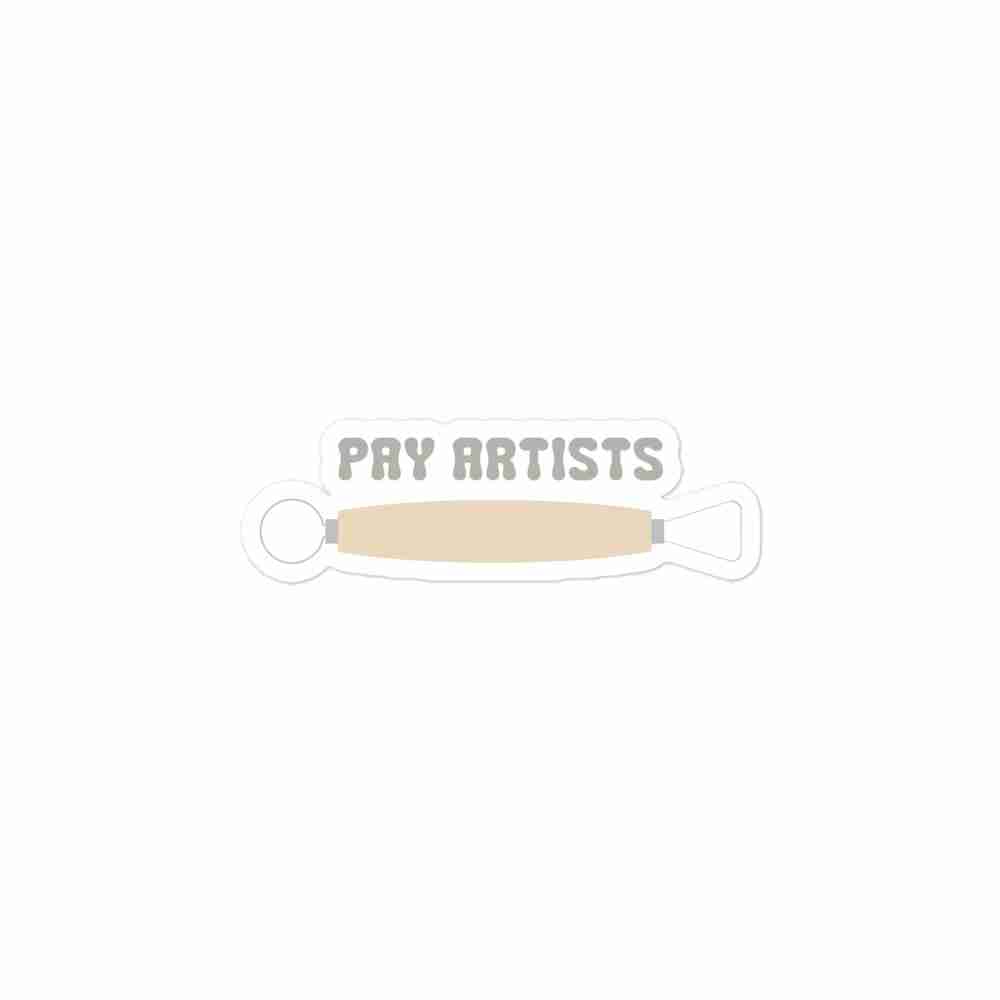 A sticker of text reading "Pay Artists" with a clay sculpting tool.