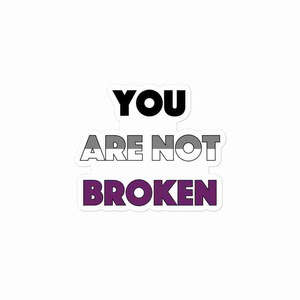 A sticker of text reading "You are not broken" in all caps; "You" is black, "are not" is striped gray and white horizontally, and "broken" is purple.