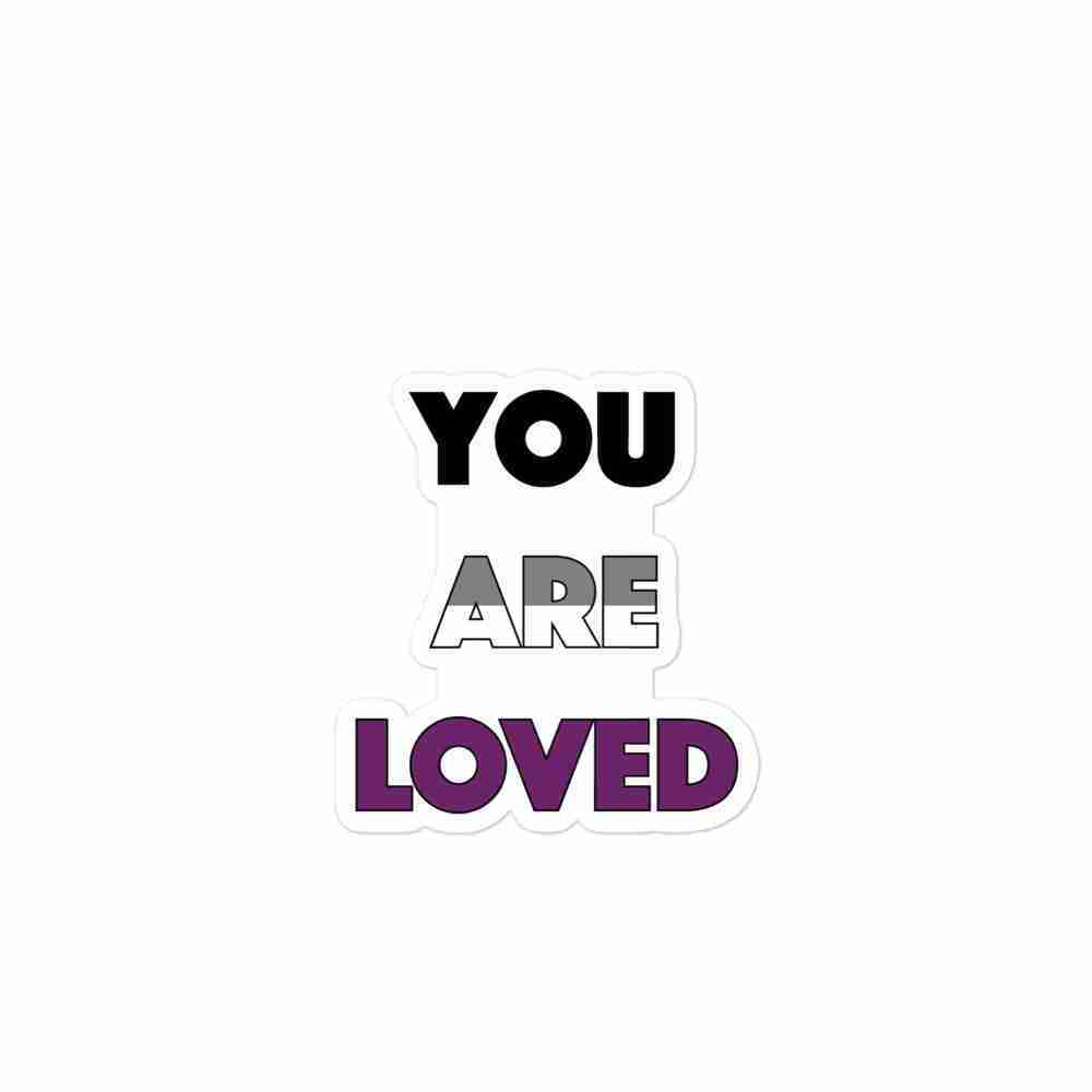 A sticker of text reading "You are loved" in all caps; "You" is black, "are" is striped gray and white horizontally, and "loved" is purple.