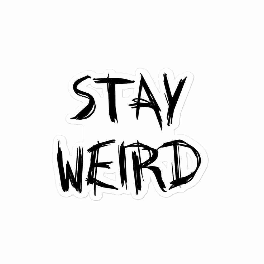 A sticker of uppercase text reading "Stay Weird".