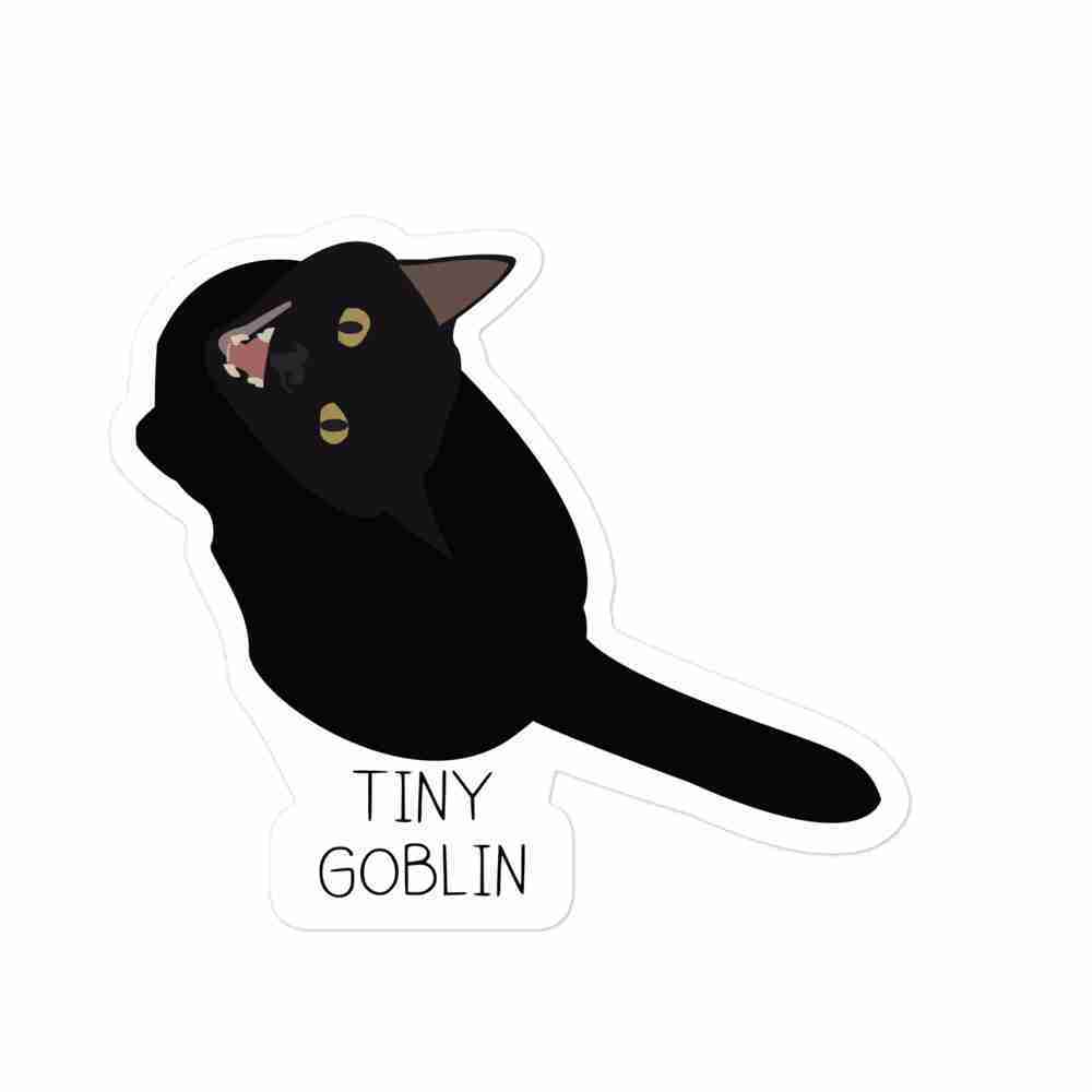A sticker of a black cat mid-meow, with text underneath reading "tiny goblin".