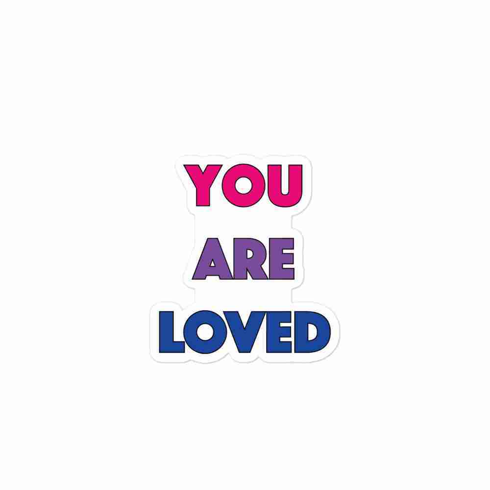 A sticker of text reading "You are loved" in all caps; "You" is magenta, "are" is purple, and "loved" is royal blue.