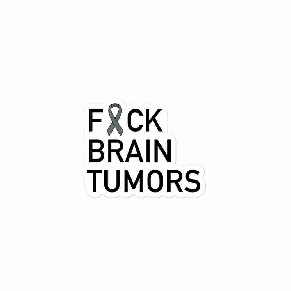 A sticker of text reading "Fuck Brain Tumors" with the U censored with a gray awareness ribbon.