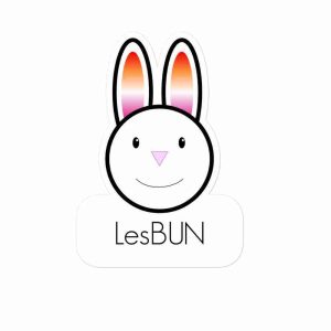 A sticker of a bunny with lesbian flag-patterned ears and text underneath reading "lesBUN".