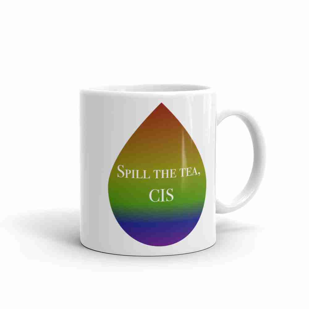 A white right handed mug with a rainbow colored tea drop containing the words "Spill the tea, cis".