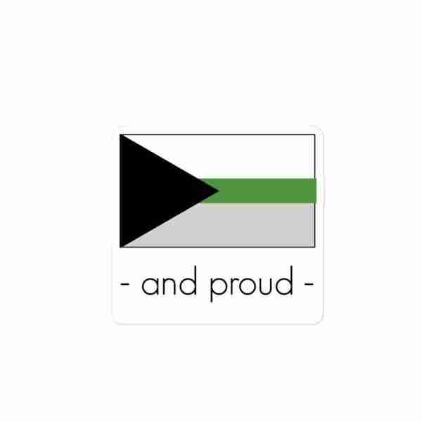 A sticker of a demiromantic pride flag with text underneath reading "and proud".