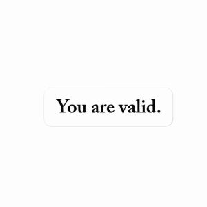 A sticker of text reading "you are valid".
